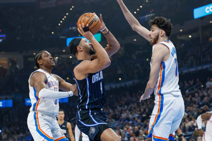 Orlando Magic guard Jalen Suggs (4) drives on Oklahoma City forward and former Minnehaha High School (Minnesota) teammate Chet Holmgren (7) on Jan. 13.